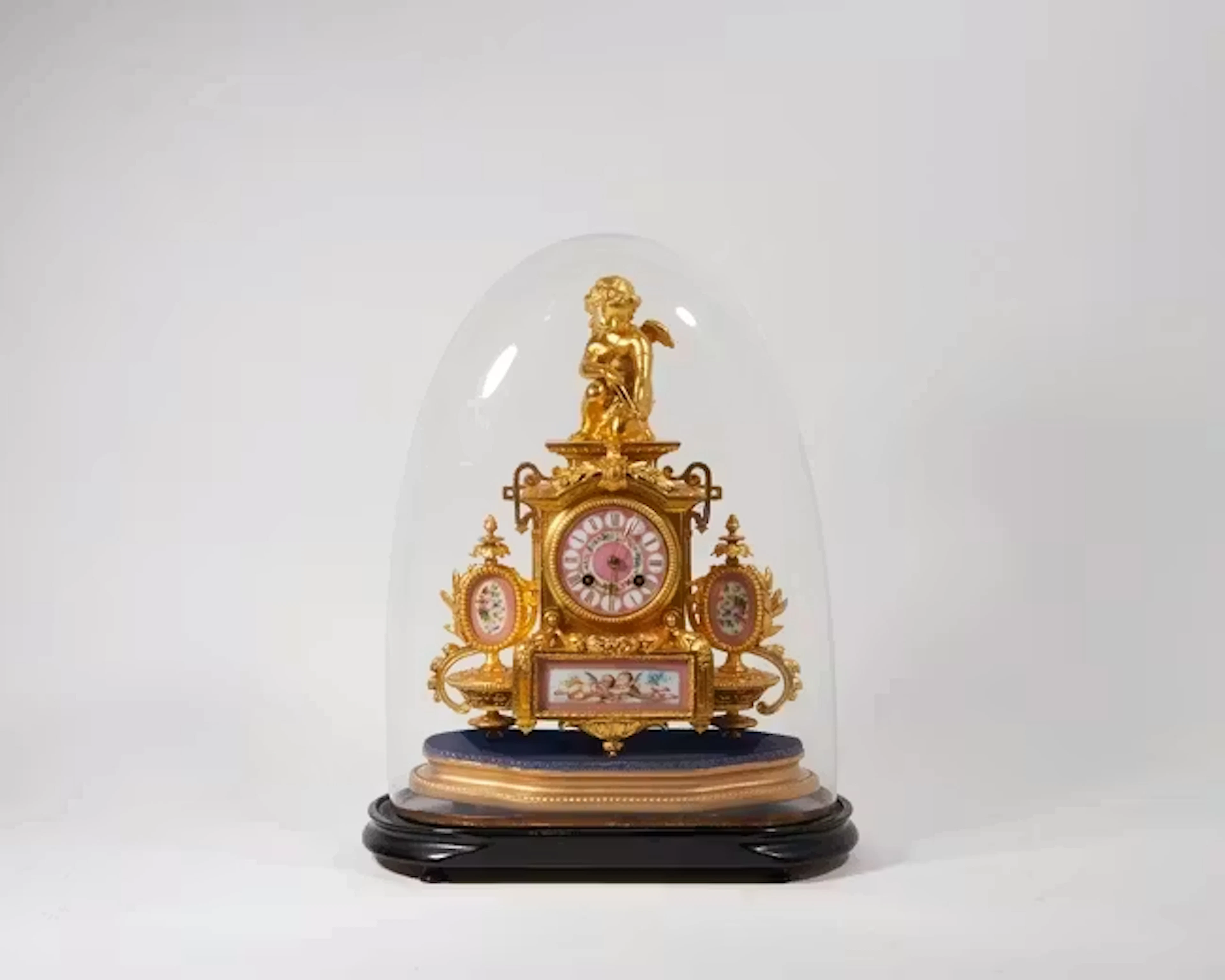 A gilt-metal and porcelain Sèvres style mantle clock