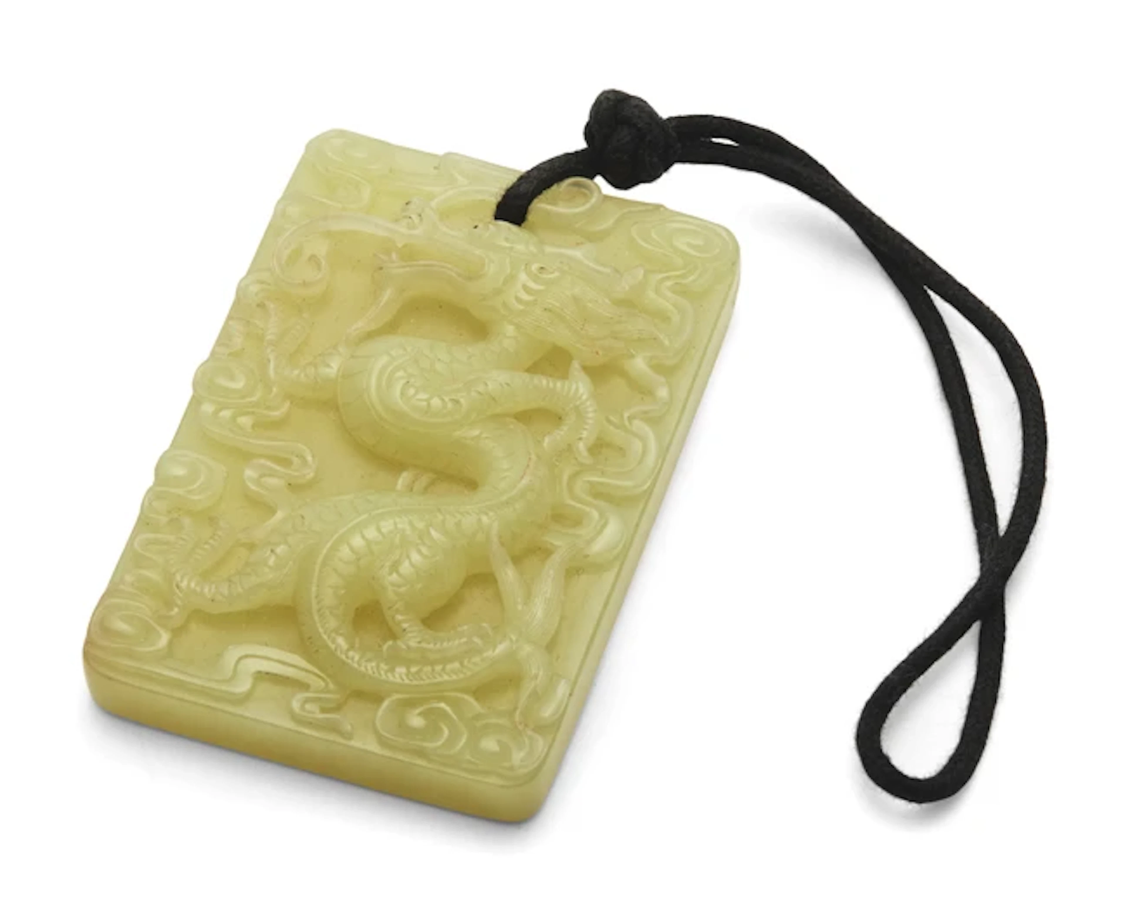 A Chinese yellow jade 'dragon' pendant plaque 20th...