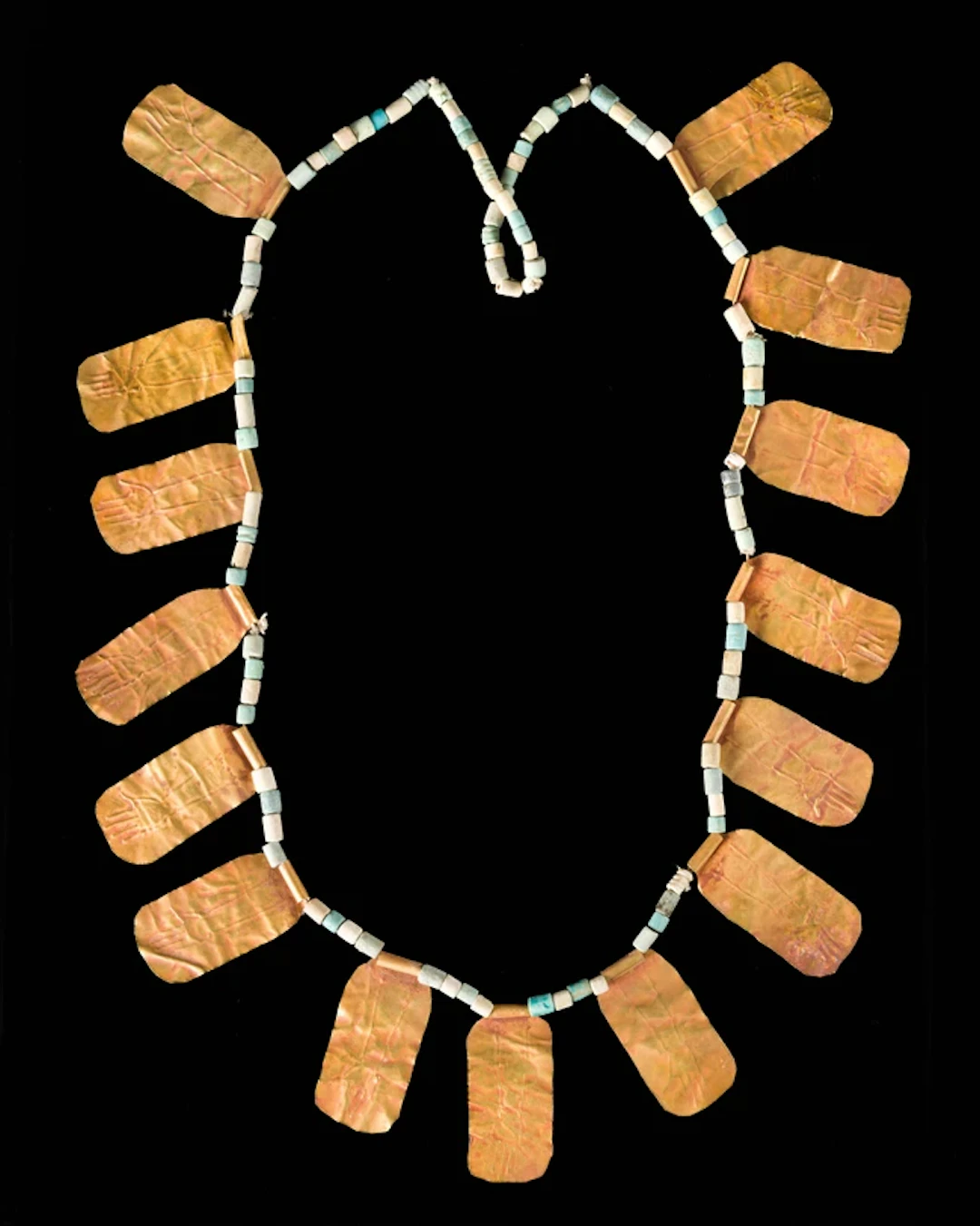 A bead necklace with gold plaques