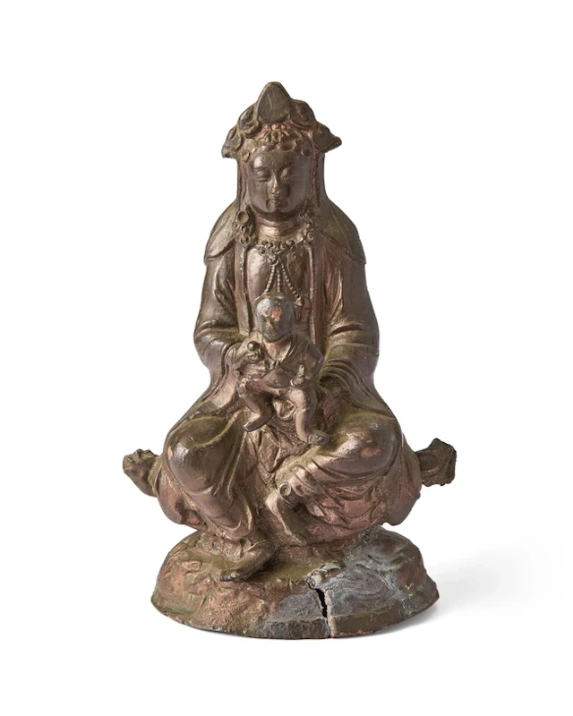 A Chinese copper-alloy figure of Guanyin 'bringer of...