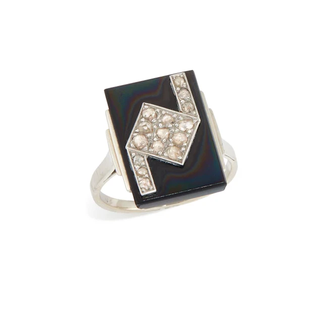 An onyx and diamond panel ring