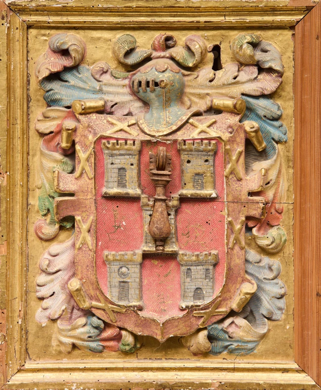 A Spanish giltwood and polychrome armorial door panel