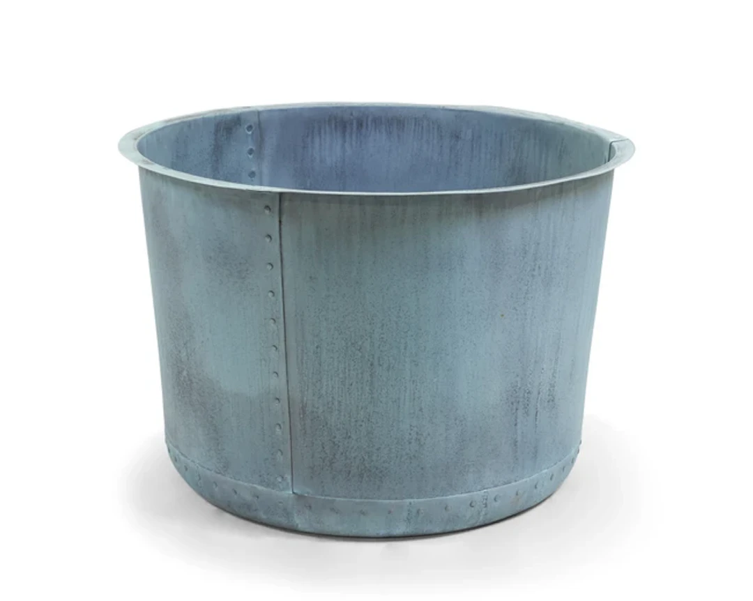 A modern large round copper planter