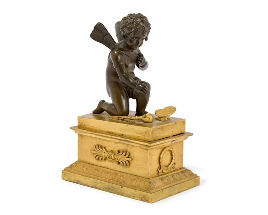 An Empire gilt and patinated bronze encrier