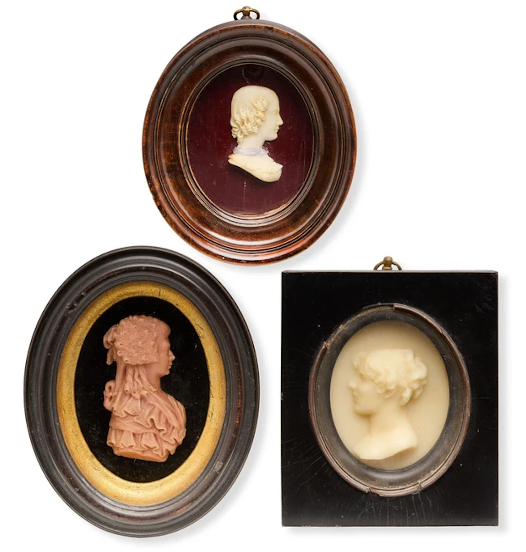 Three wax portrait reliefs of young ladies