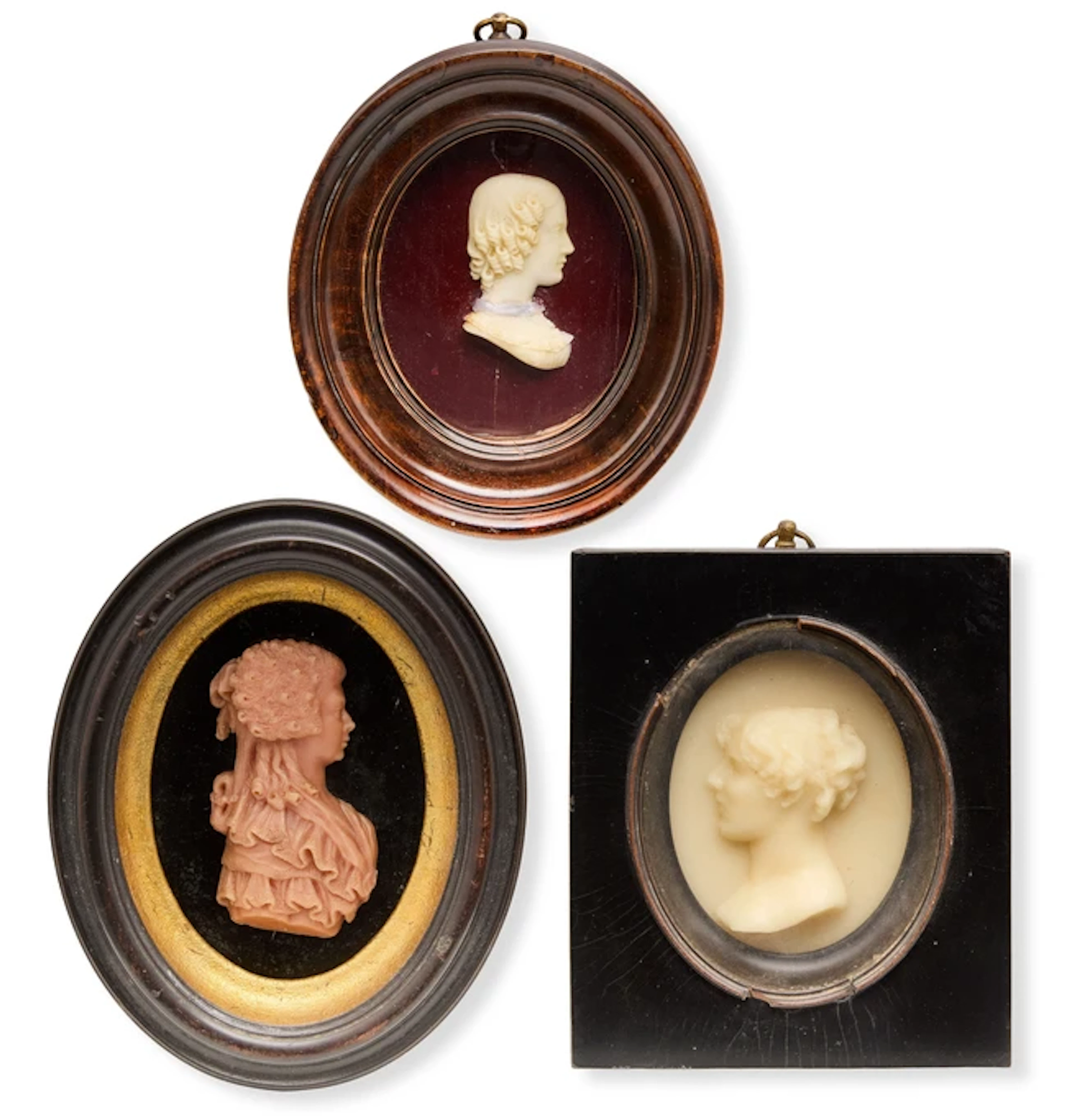 Three wax portrait reliefs of young ladies