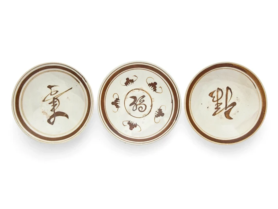 A set of Chinese Cizhou brown-painted 'Fulushou' dishes...