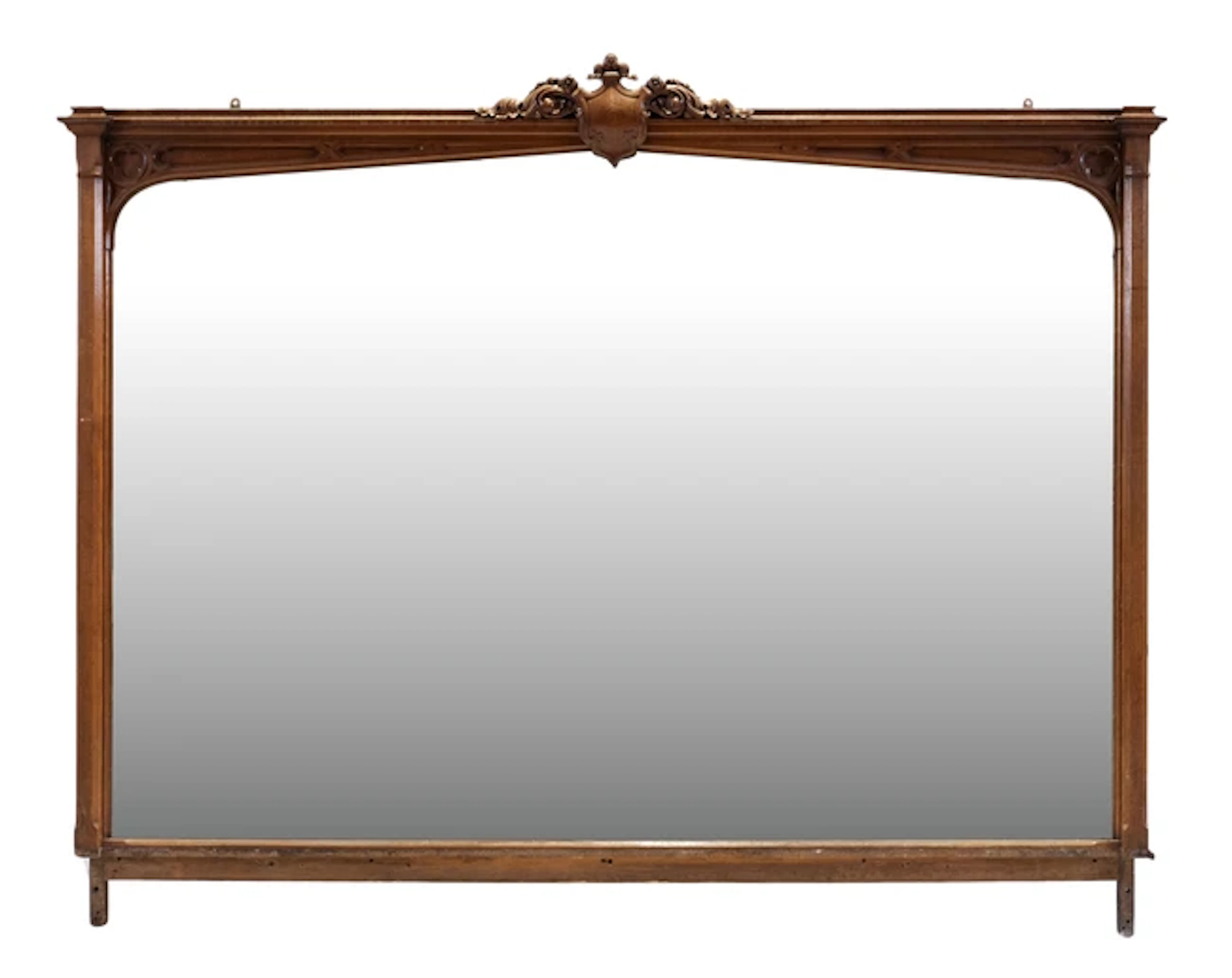 A large Victorian 'Gothic' revival carved oak overmantle mirror