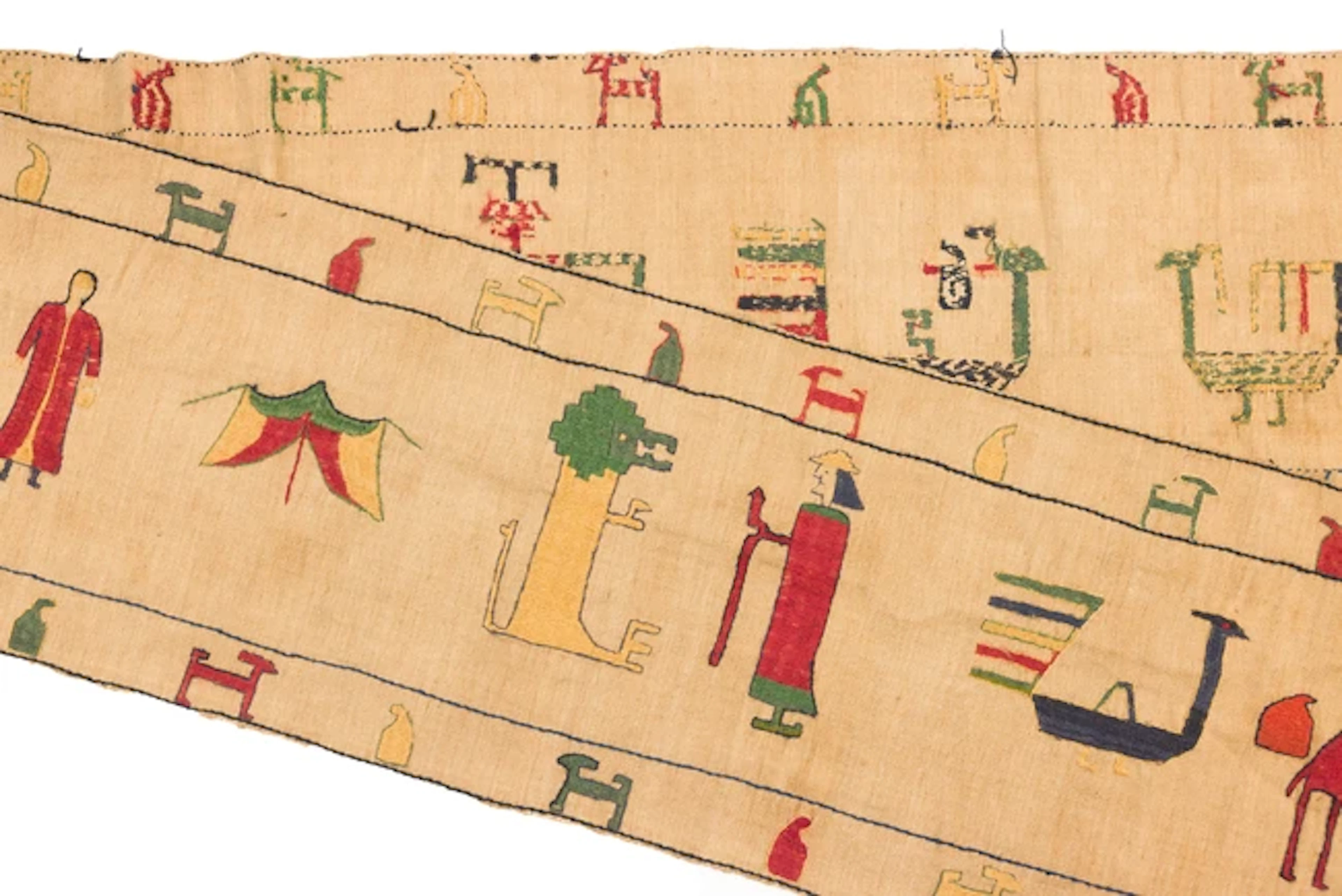 A rectangular embroidered coarse textile panel