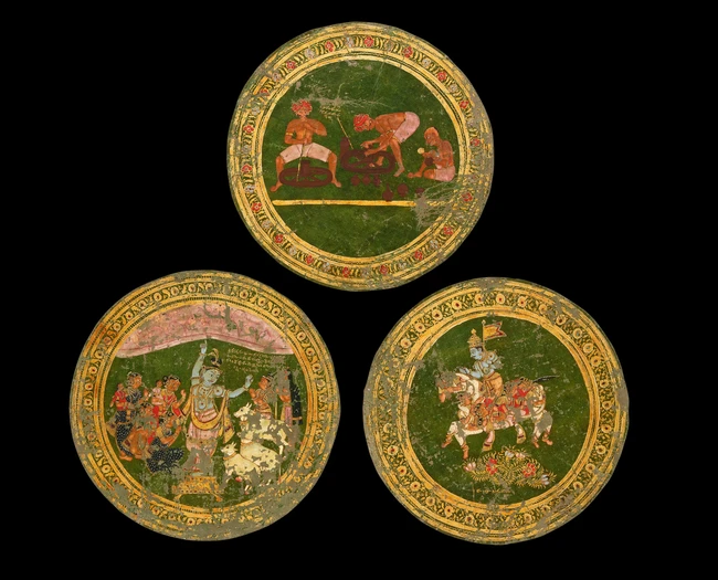 Three painted leather roundels depicting Krishna holding...