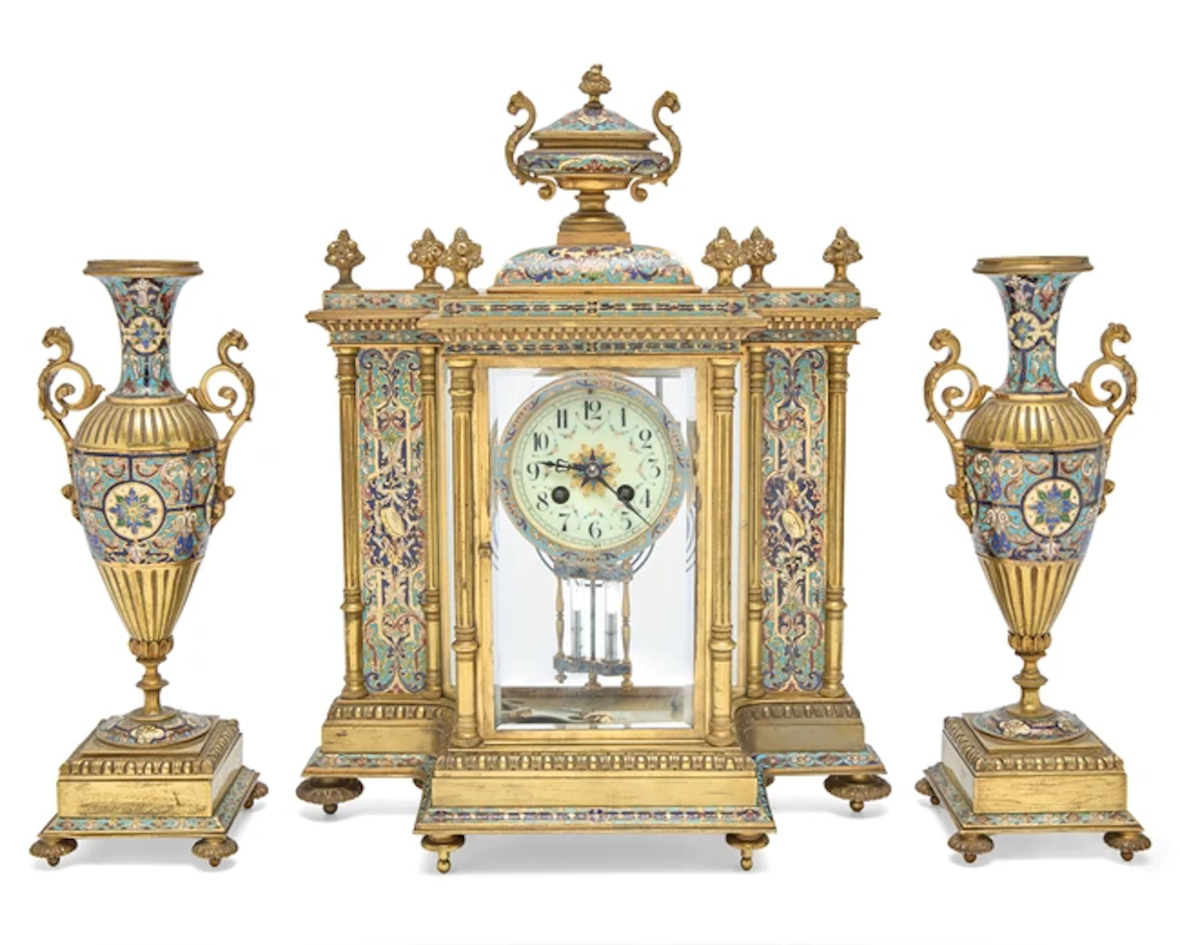 A French gilt-brass and champleve enamel clock garniture