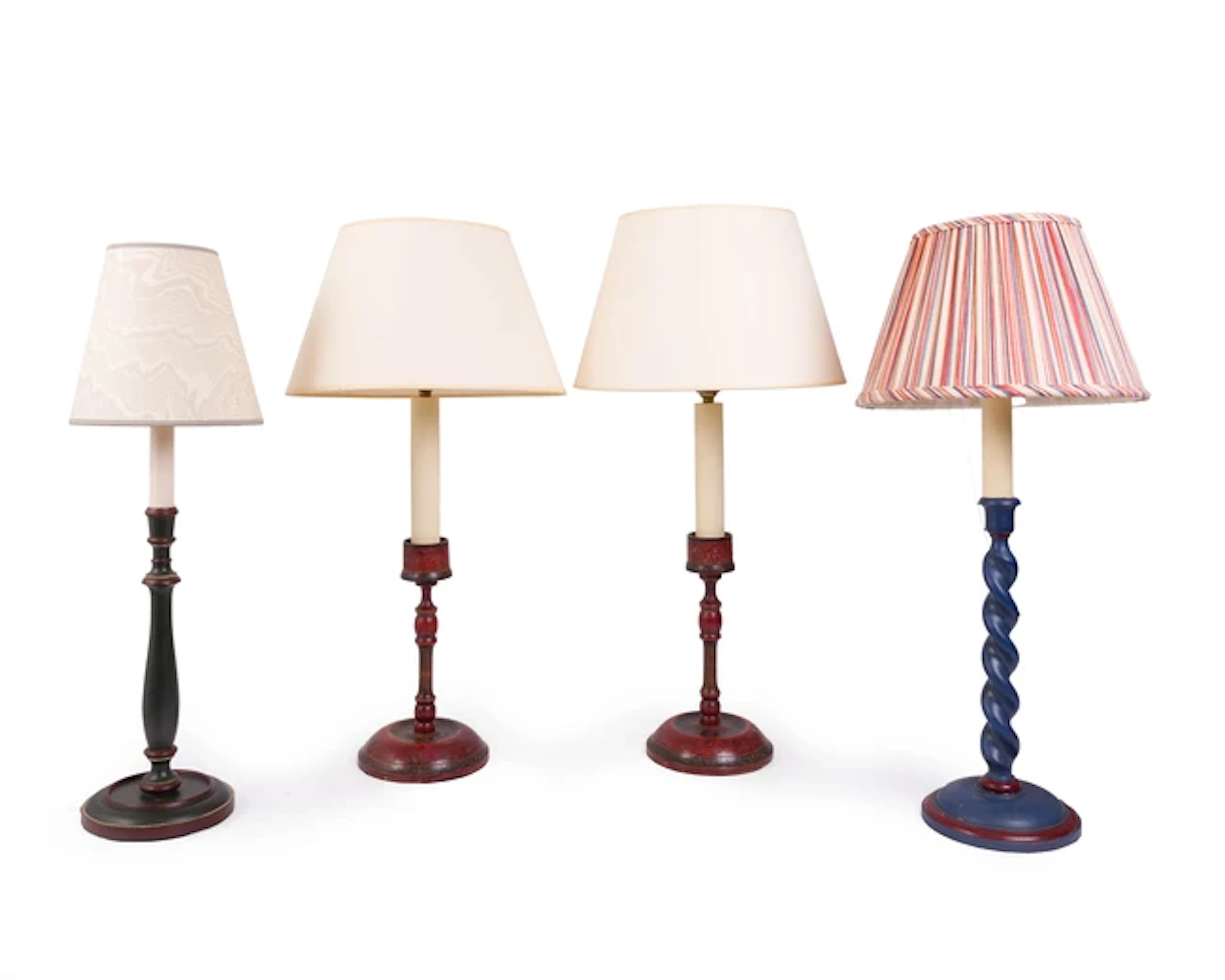 A pair of Indian red painted wood candlestick lamps