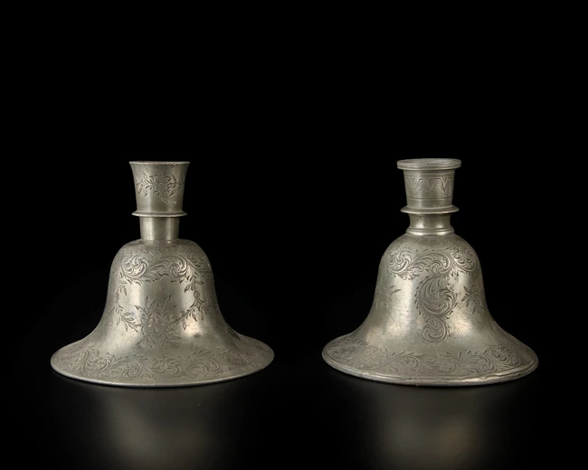 A pair of engraved tinned bell-shaped huqqa bases in the European taste