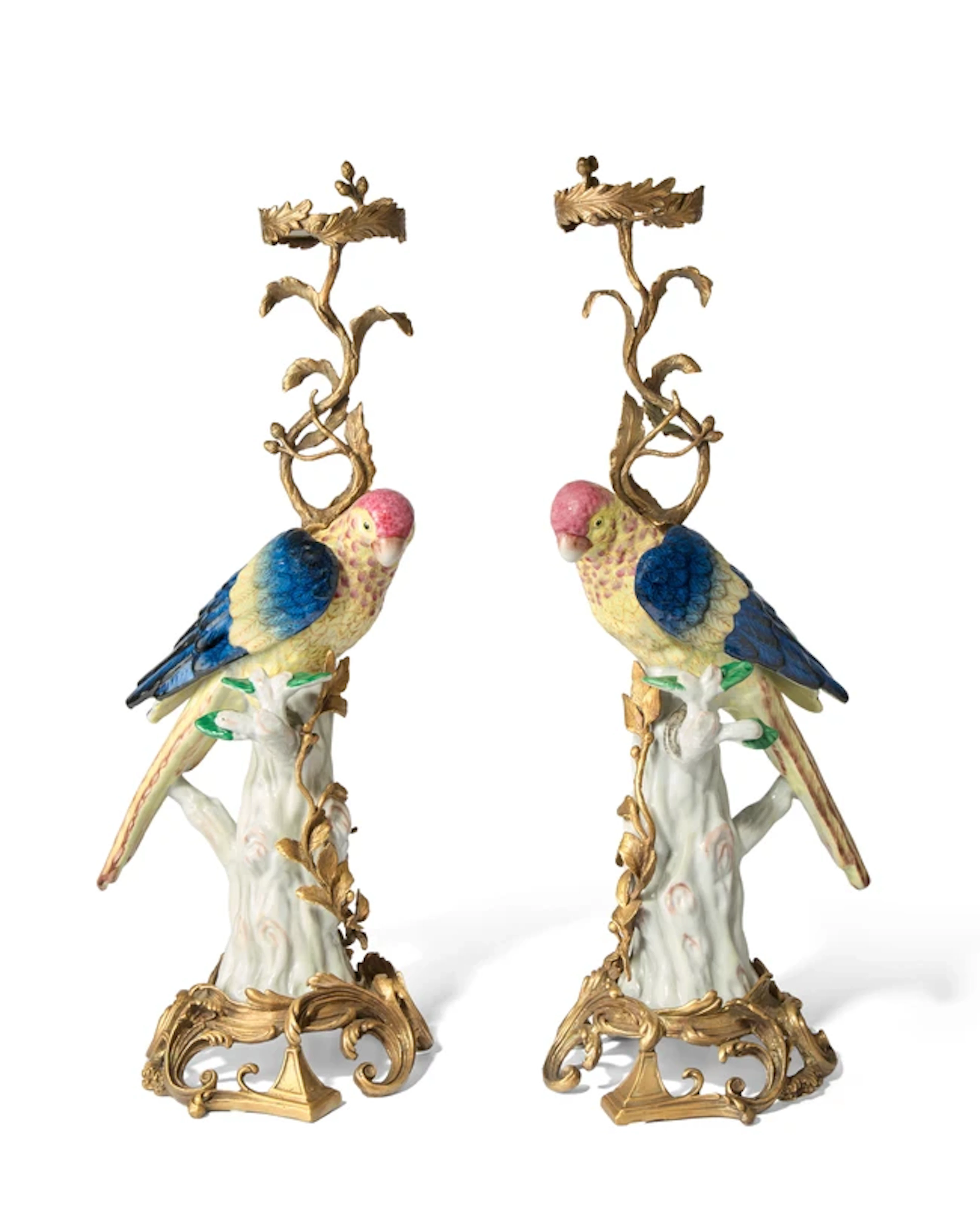 A pair of gilt-metal mounted porcelain decorative stands