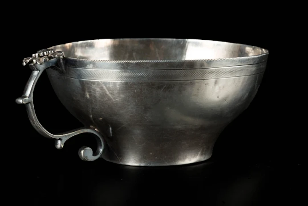 A silver handled wine cup