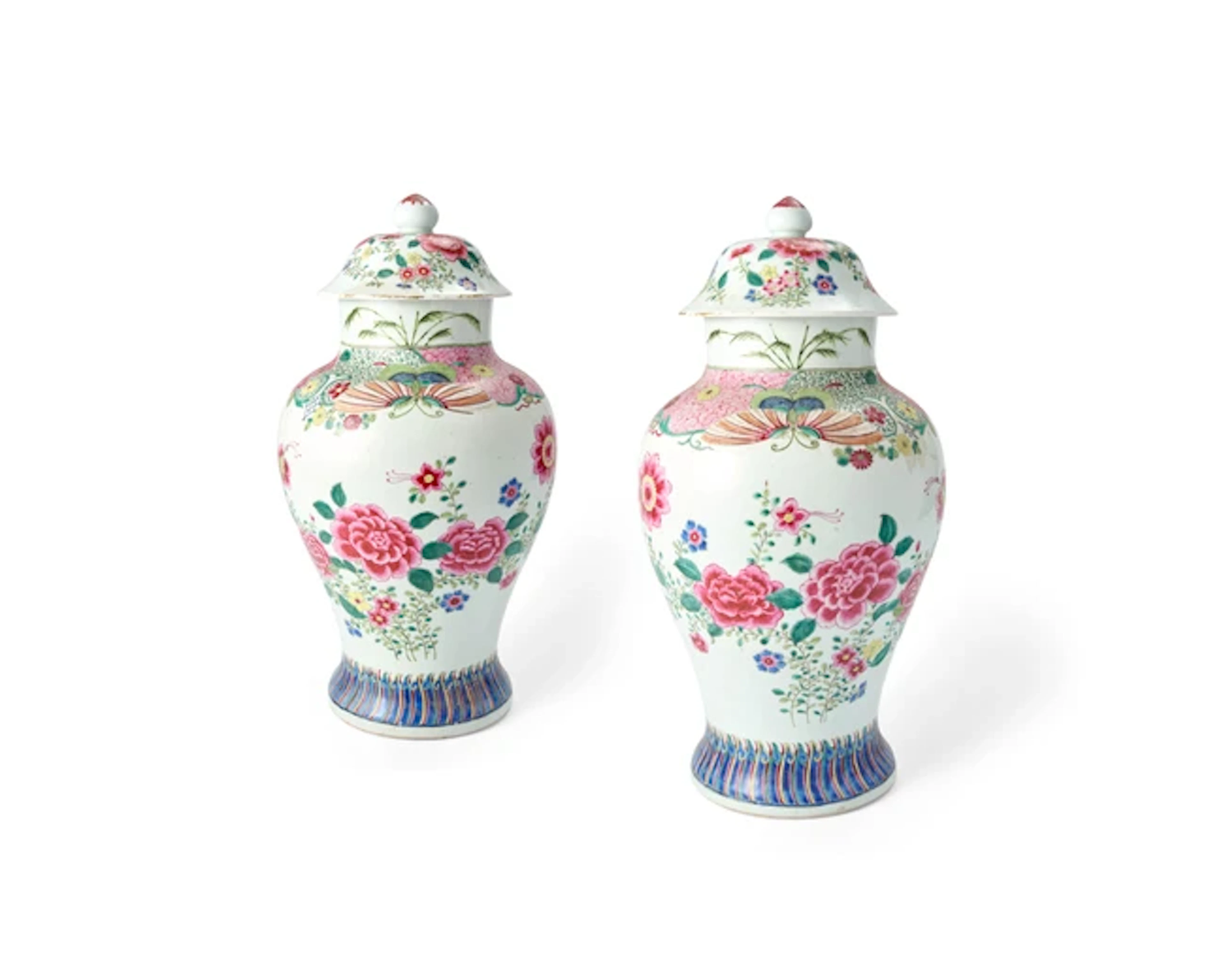 A pair of Chinese famille rose 'peony' vases and covers...