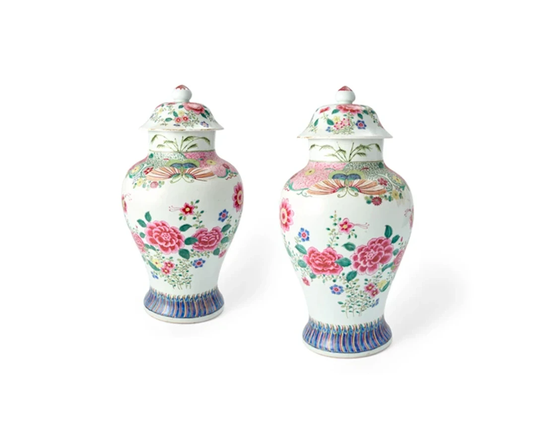 A pair of Chinese famille rose 'peony' vases and covers...