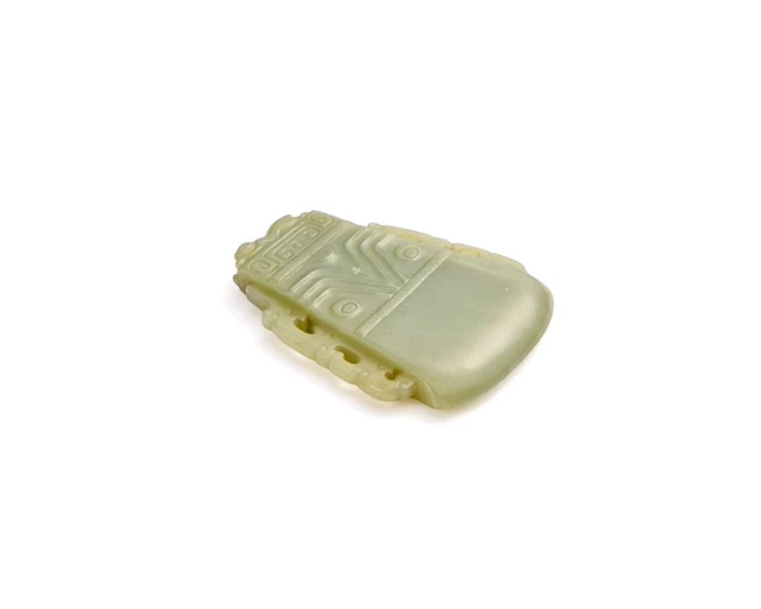 A Chinese green jade archaistic 'axe' plaque Late Qing...