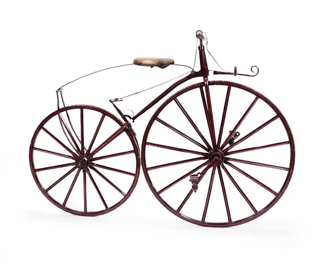 A painted iron 'bone shaker' bicycle