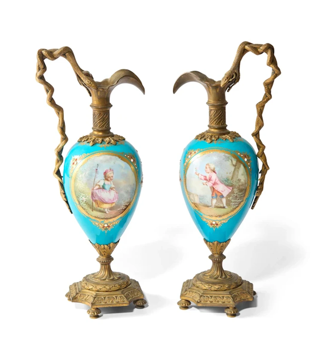 A pair of Sevres style gilt-metal-mounted porcelain vases