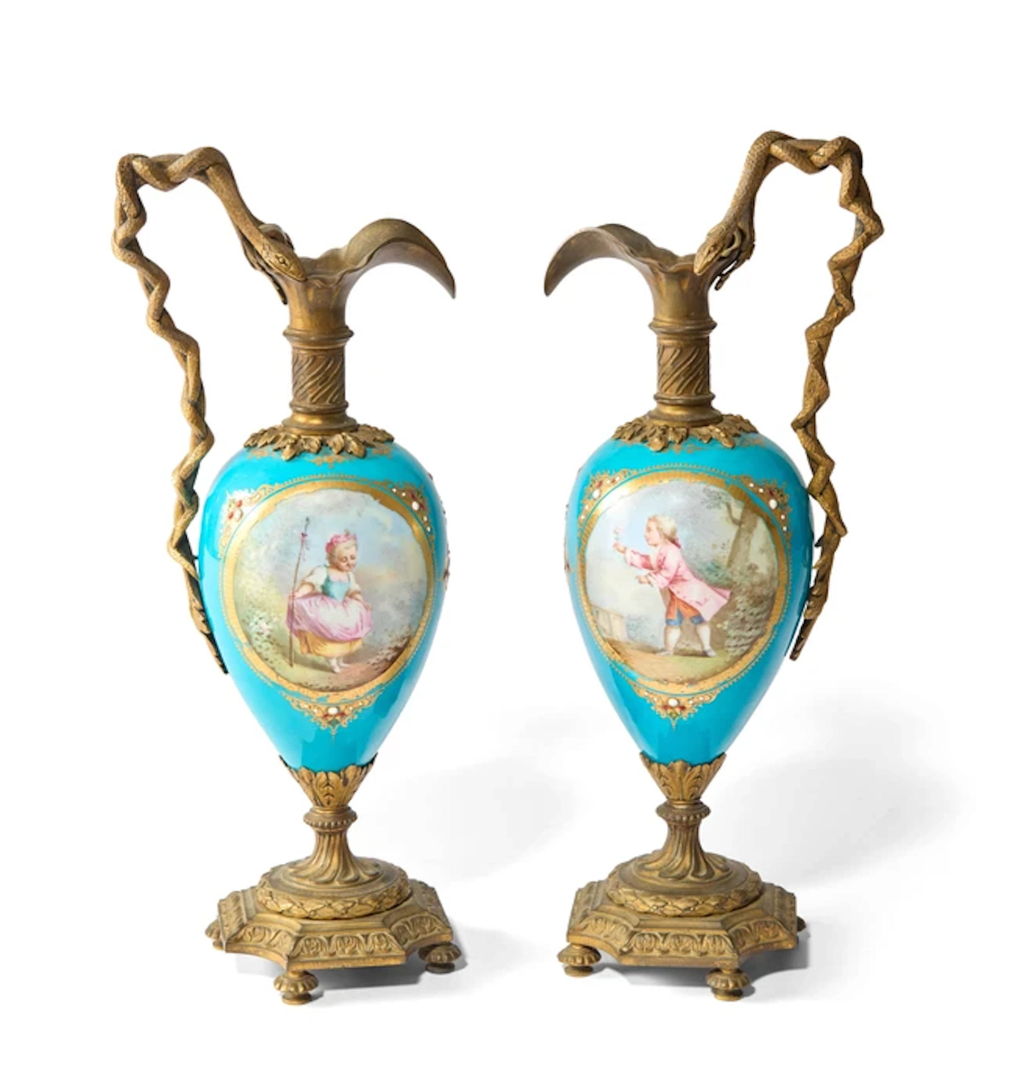 A pair of Sevres style gilt-metal-mounted porcelain vases