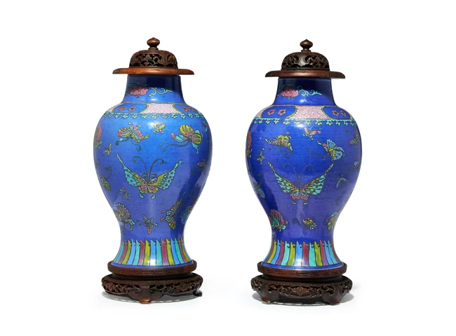 A pair of Chinese powder-blue famille rose 'butterfly' vases Qing dynasty