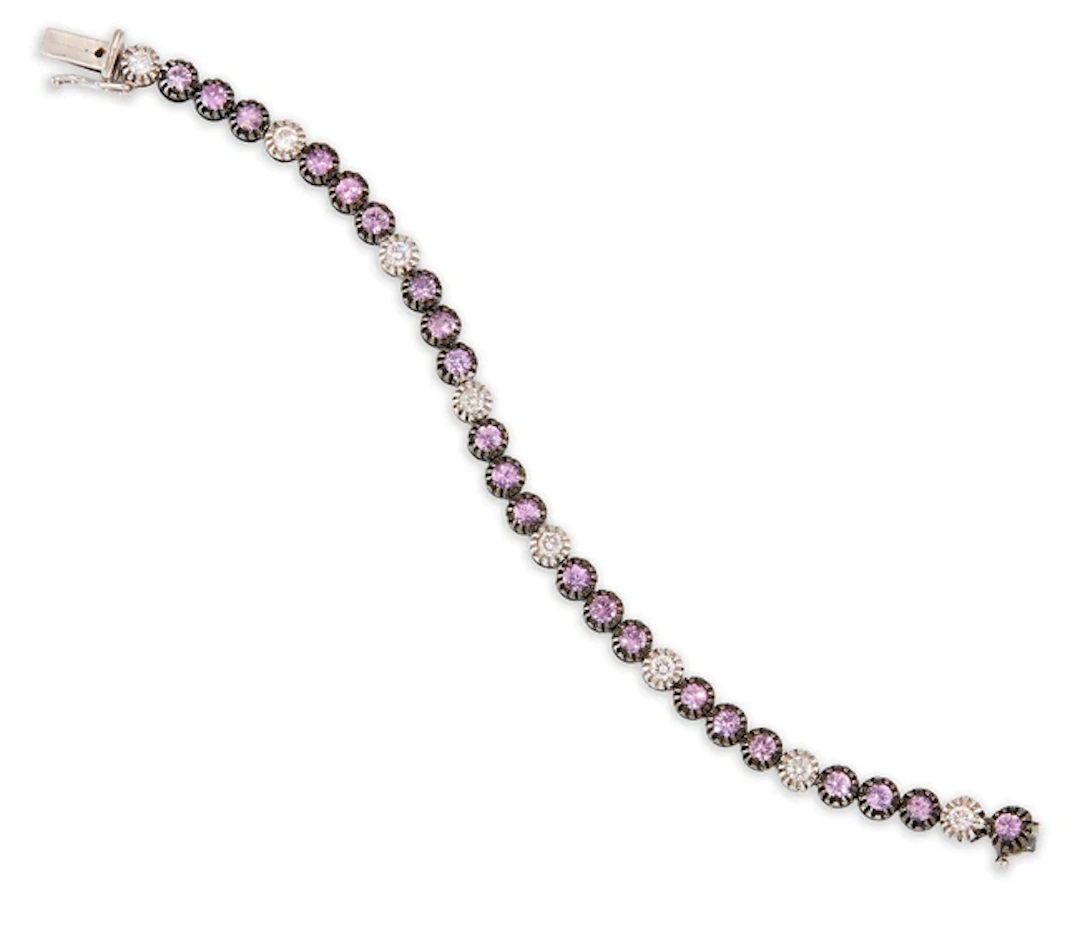 A diamond and pink sapphire line bracelet
