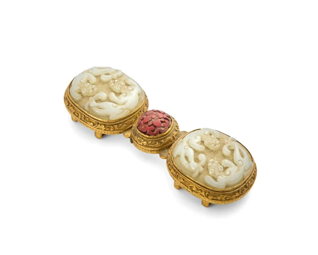 A Chinese white jade and cinnabar lacquer-inset...