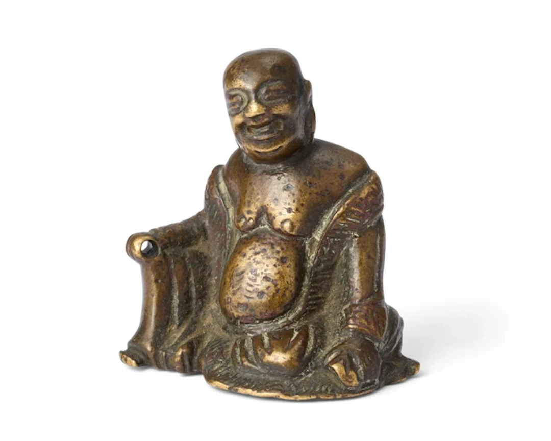 A small Chinese bronze Budai scroll weight 17th century...