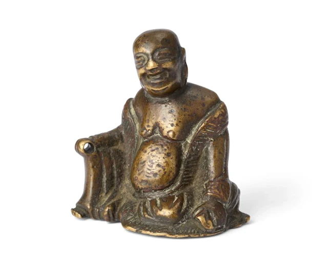 A small Chinese bronze Budai scroll weight 17th century...