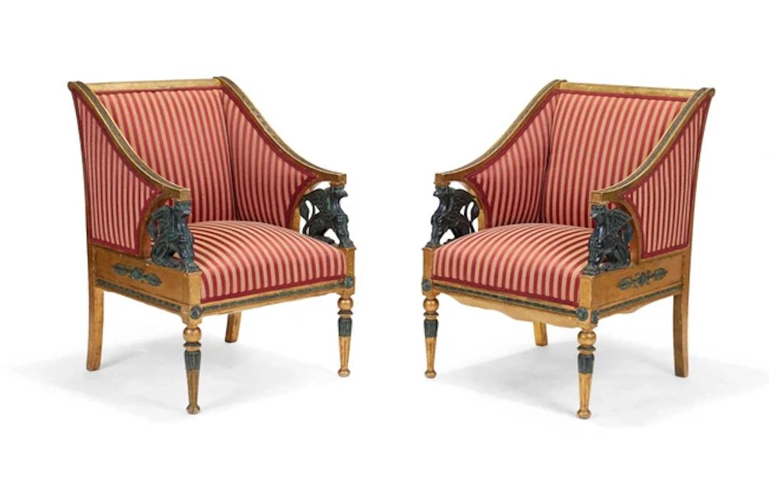A pair of French giltwood and parcel green painted armchairs