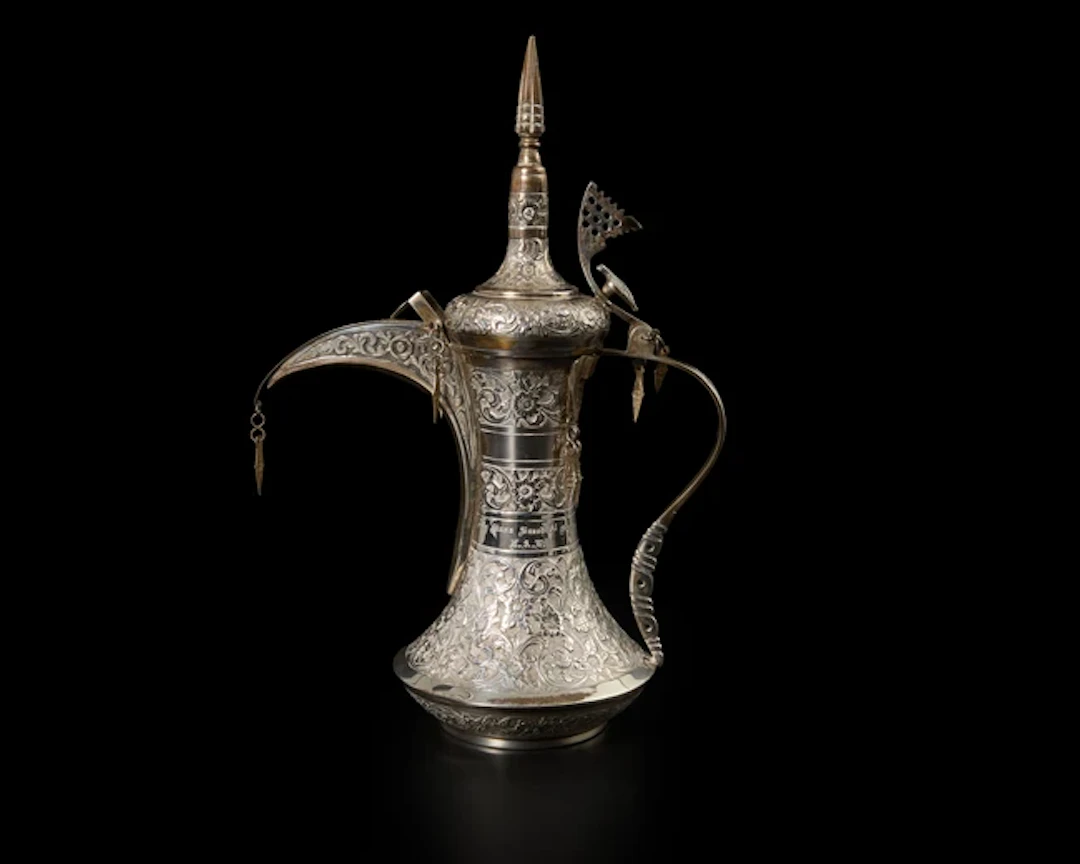 A presentational silver coffee pot