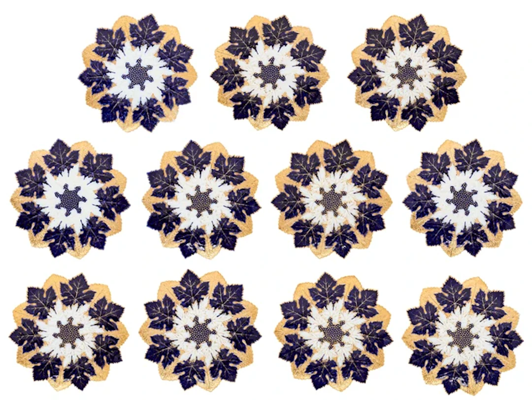 Eleven Meissen porcelain relief-moulded plates