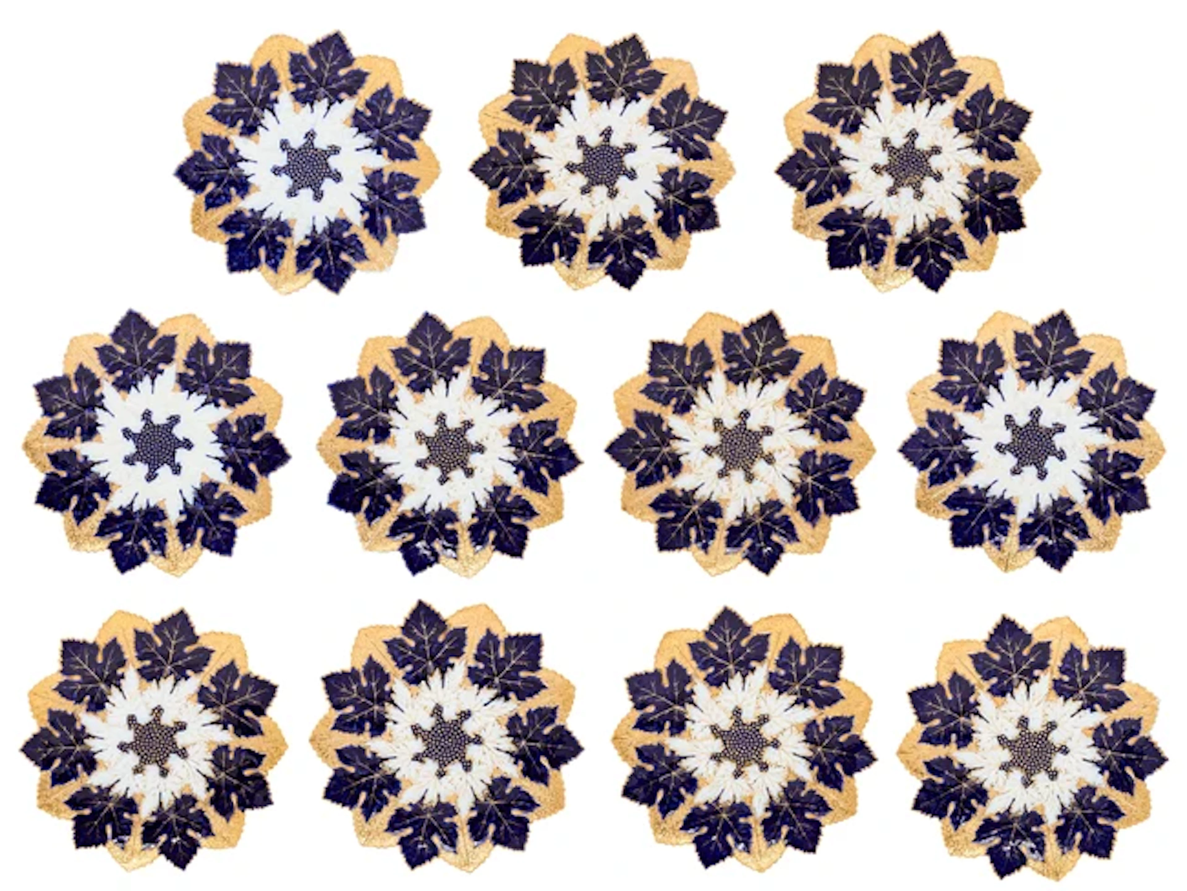 Eleven Meissen porcelain relief-moulded plates