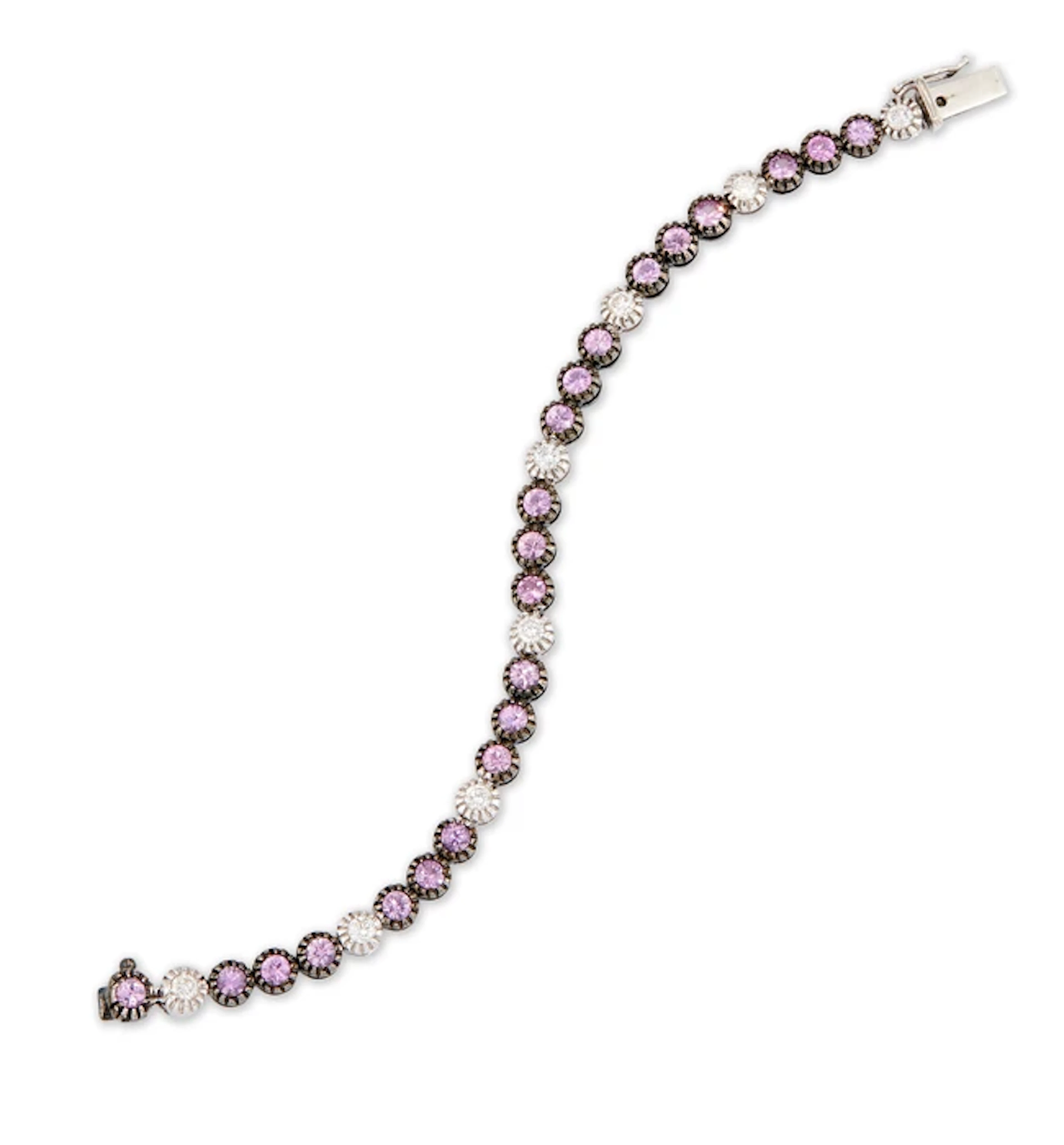 A diamond and pink sapphire line bracelet