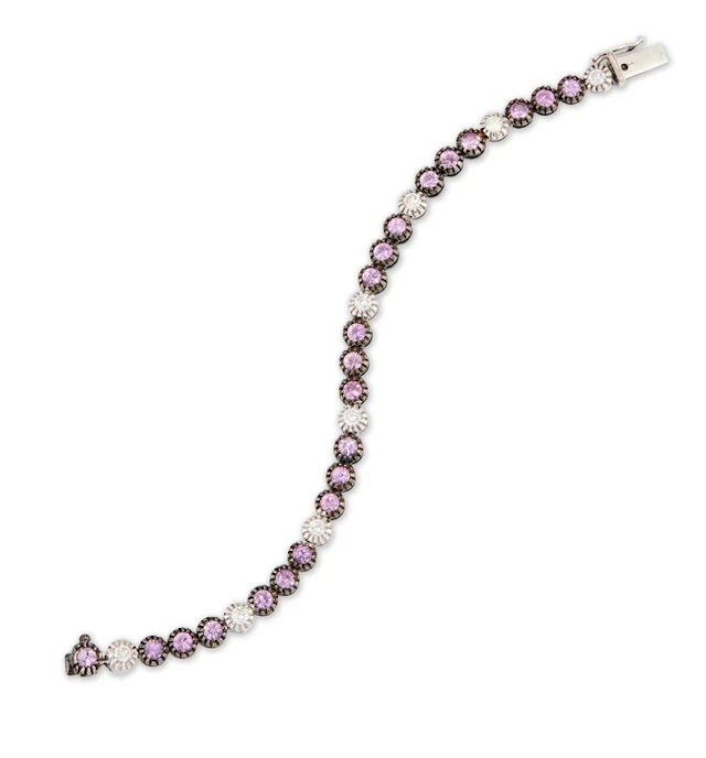 A diamond and pink sapphire line bracelet