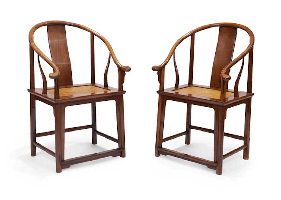 A pair of Chinese huanghuali horseshoe-back armchairs