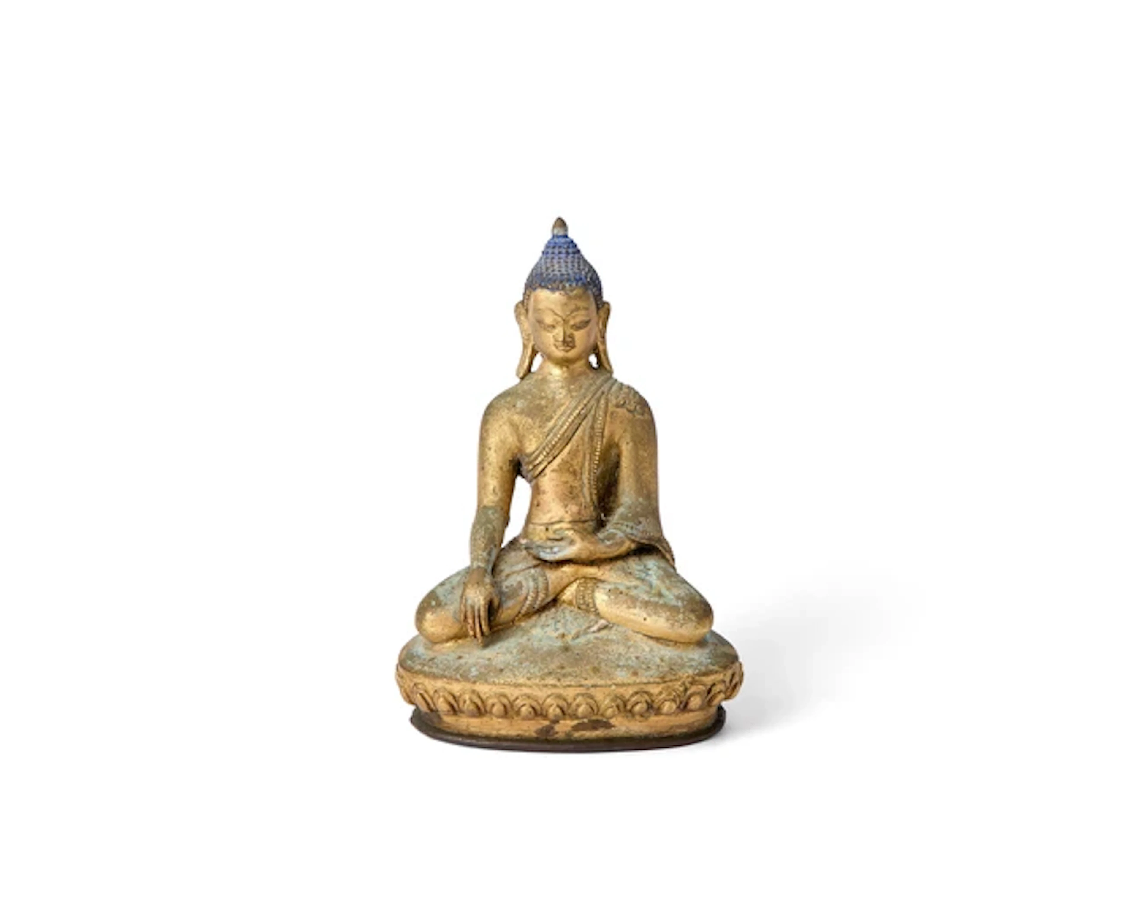 A Tibetan gilt-bronze figure of seated Buddha 18th/19th...