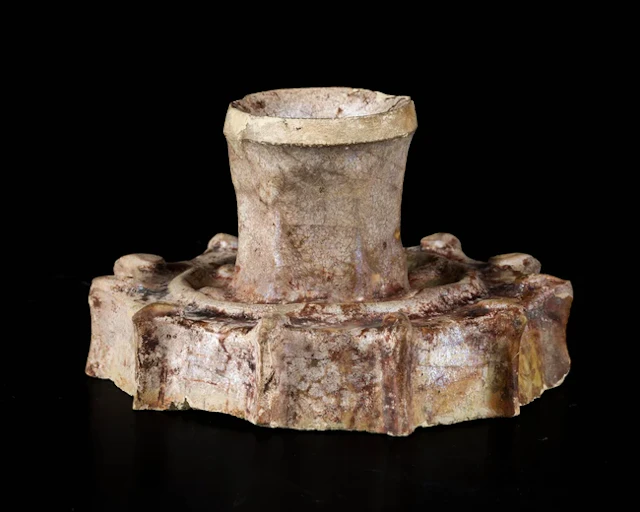 A fine glazed lustre ware Raqqa candlestick