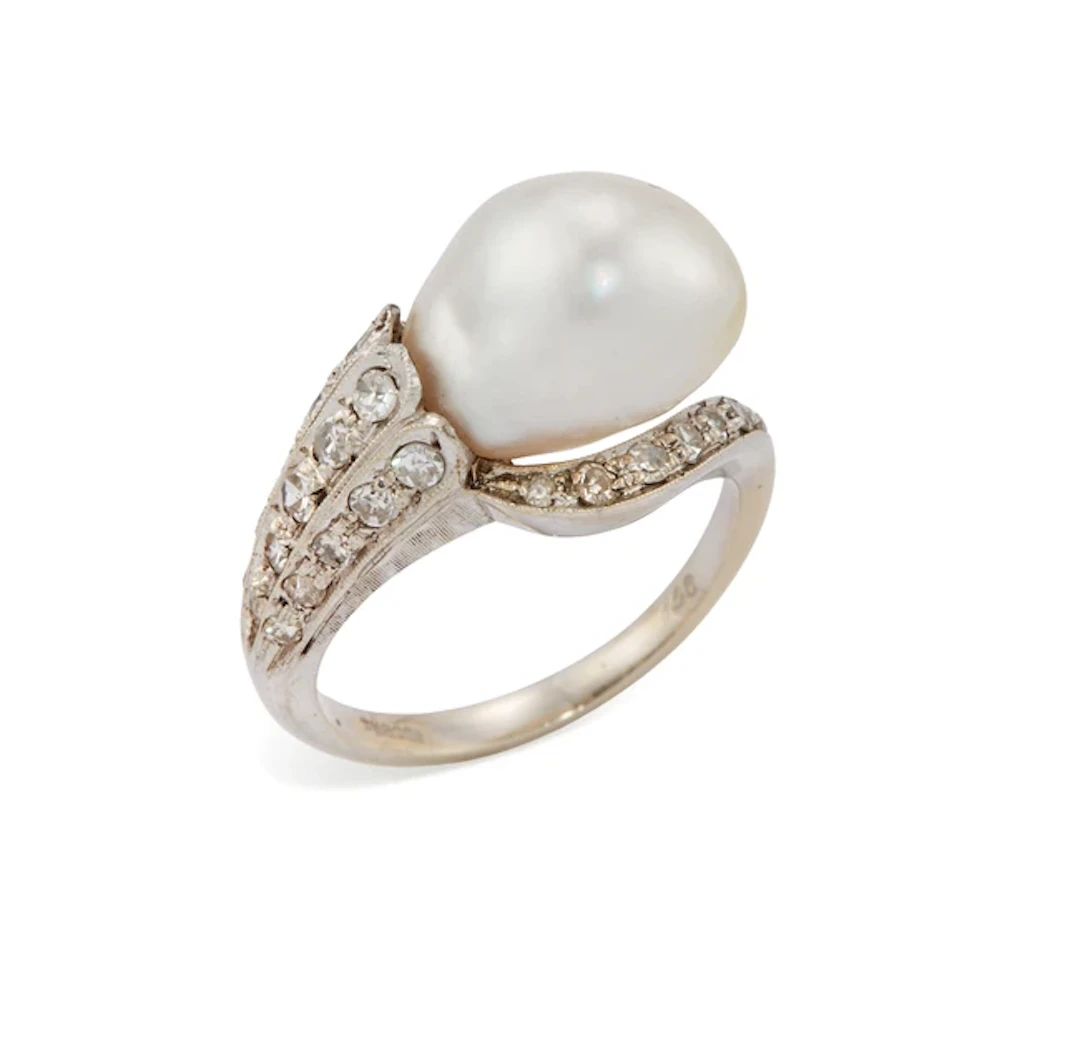 A pearl and diamond ring