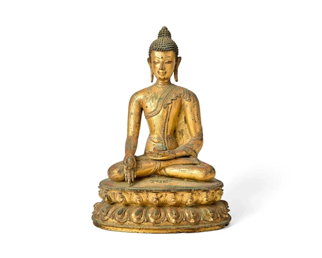 A Tibetan gilt copper-alloy figure of seated Medicine Buddha
