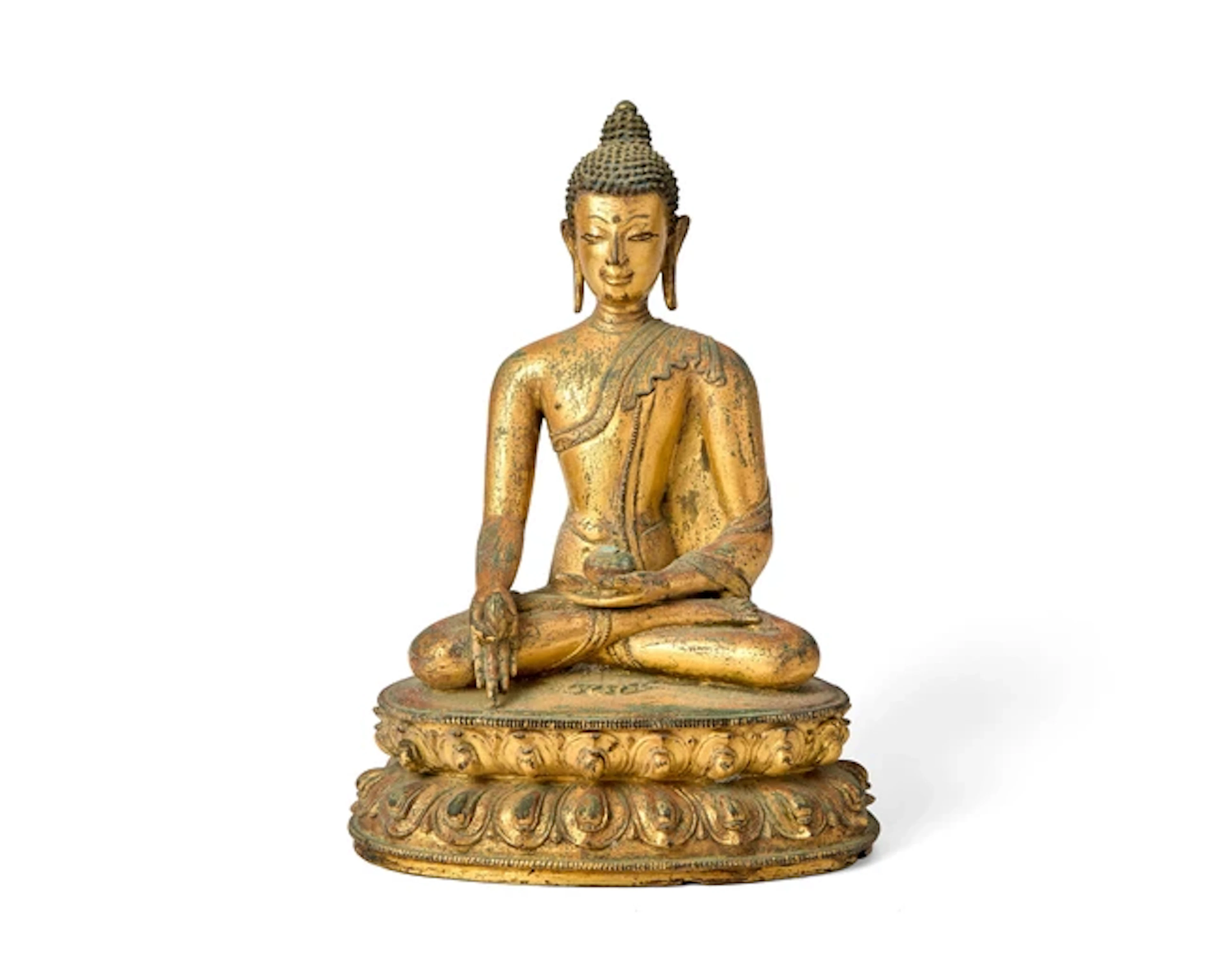 A Tibetan gilt copper-alloy figure of seated Medicine Buddha