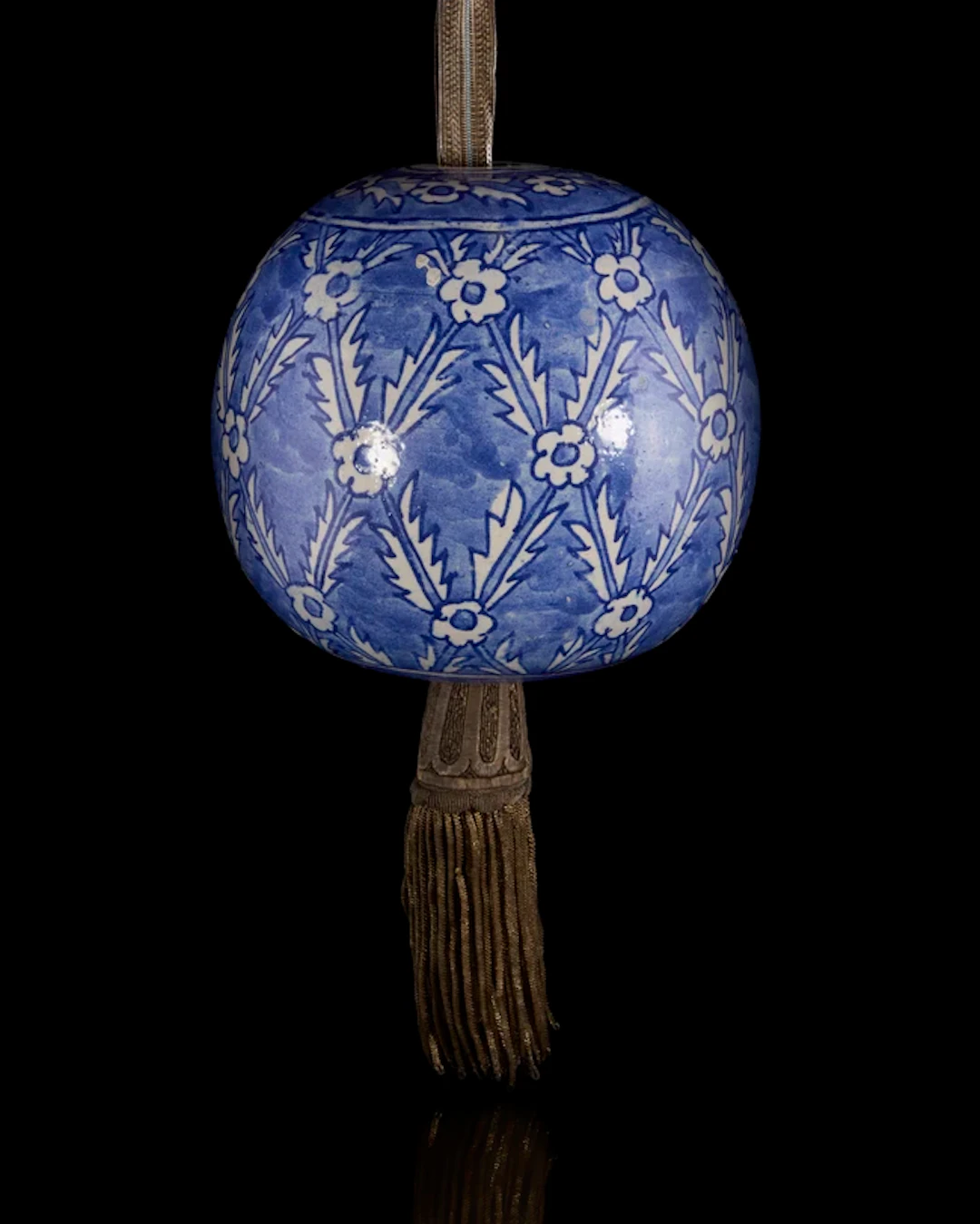 A spherical hanging blue and white pottery ornament