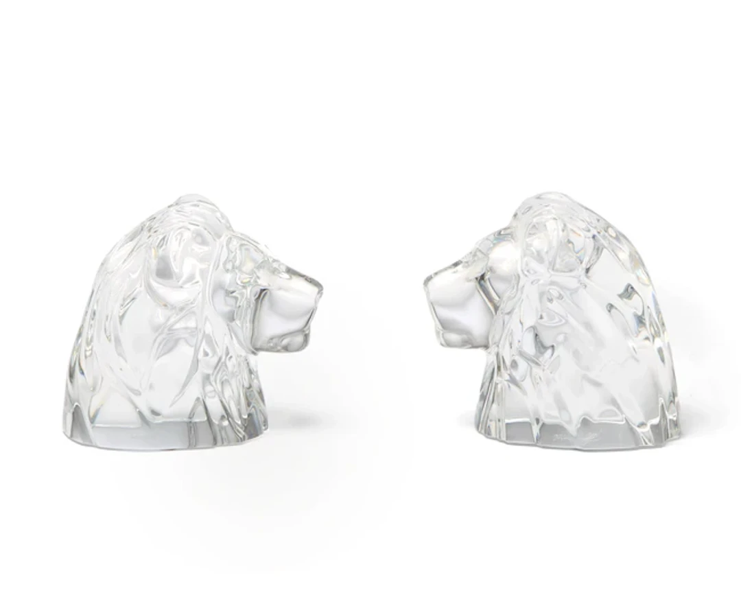 A pair of Baccarat crystal paperweights modelled as lion heads