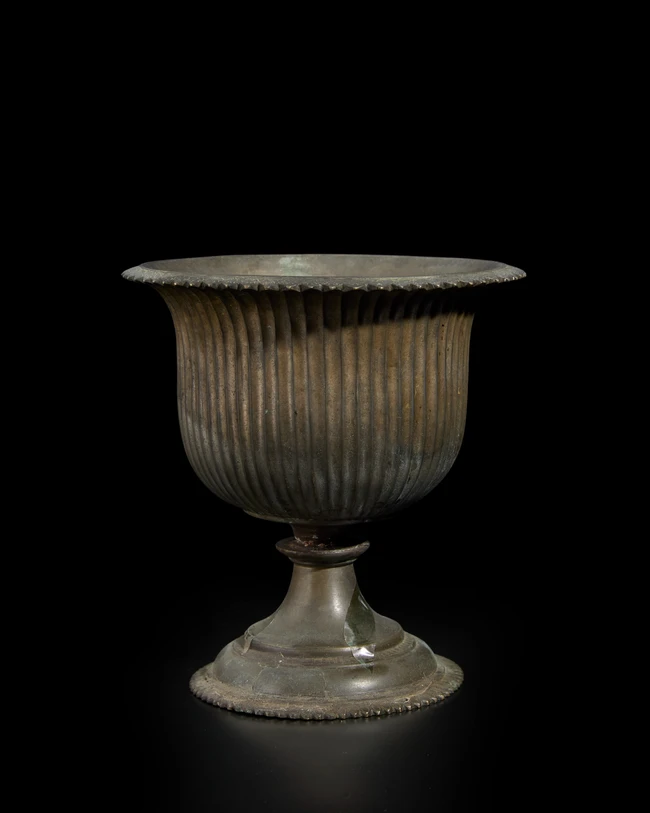 A gadrooned flaring bronze cup