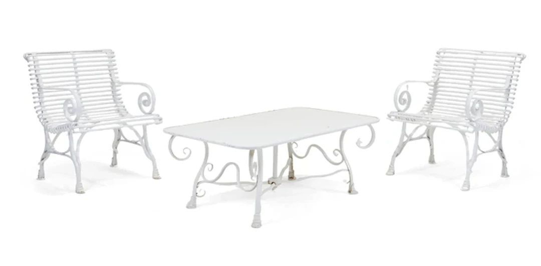 A pair of modern white-painted iron Arras style chairs
