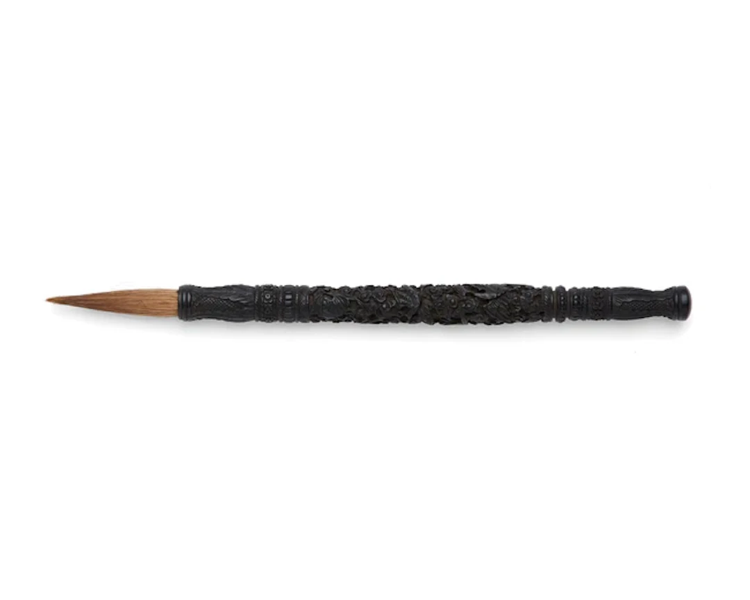 A Chinese carved hardwood 'phoenix and bats' brush