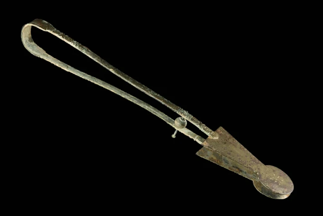 A pair of engraved bronze brazier tongs