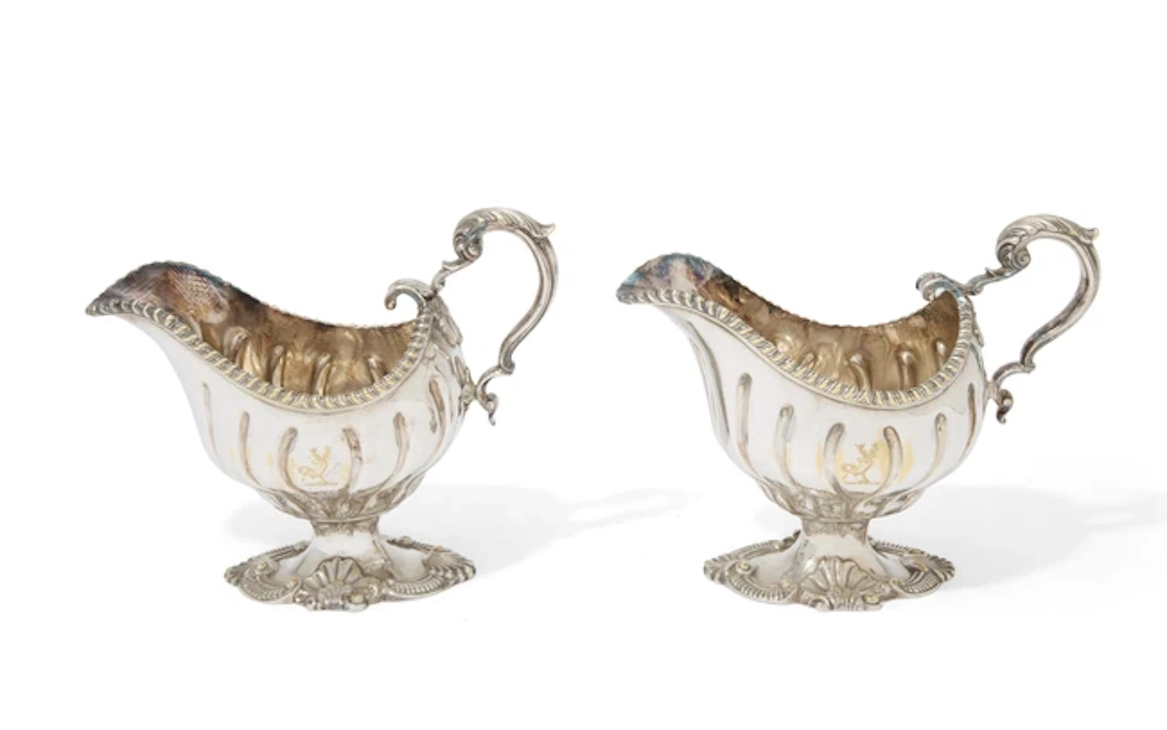 A pair of George III silver sauce boats