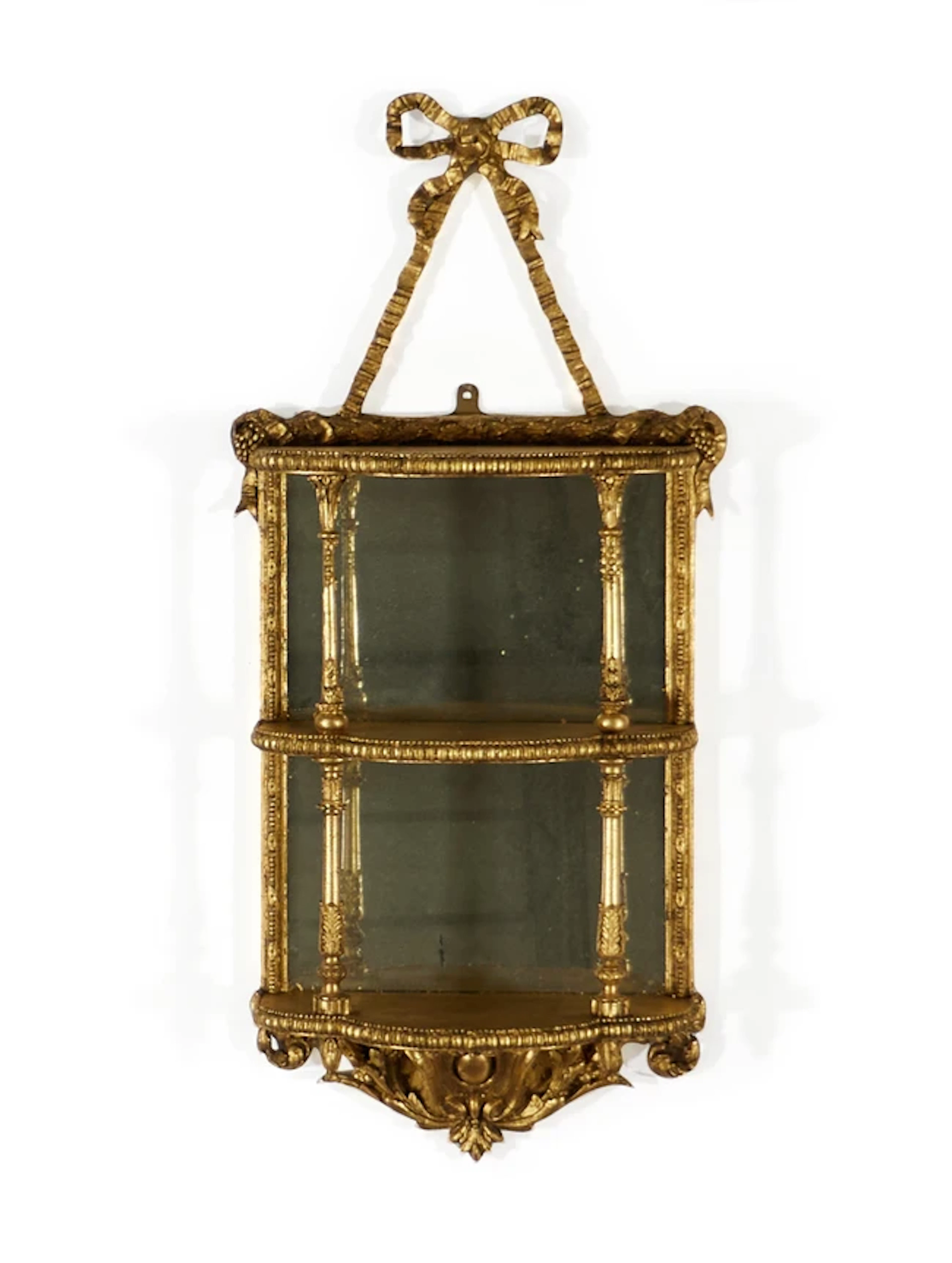 A French giltwood and gesso mirror back shelf